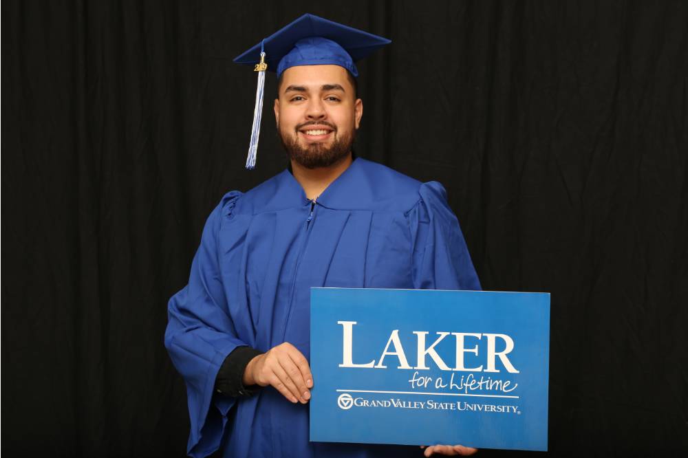 man at GradFest with laker for a lifetime sign